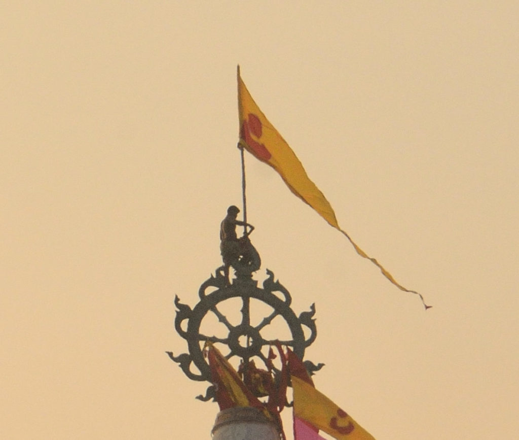 The daily flag changing ritual atop Lord Jagannath temple, Puri, Odisha